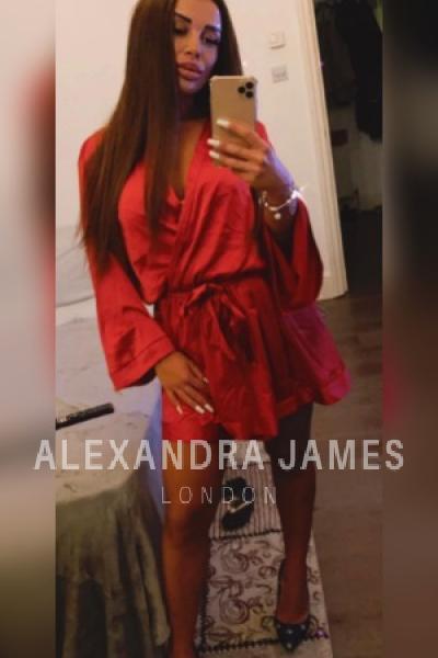 Jessica taking a selfie in a red dress