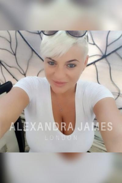Pink taking a selfie wearing a white top